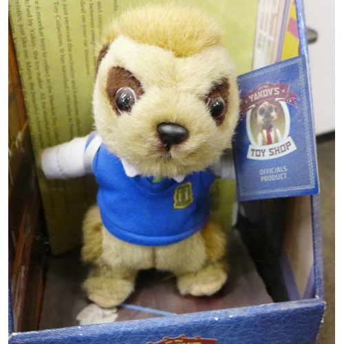 1103 - A collection of boxed Meerkat toys with certificates, together with other toys including a talking d... 