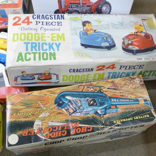 1105 - Boxed tinplate and battery operated toys and a Massey Ferguson 1:16 tractor, a/f **PLEASE NOTE THIS ... 