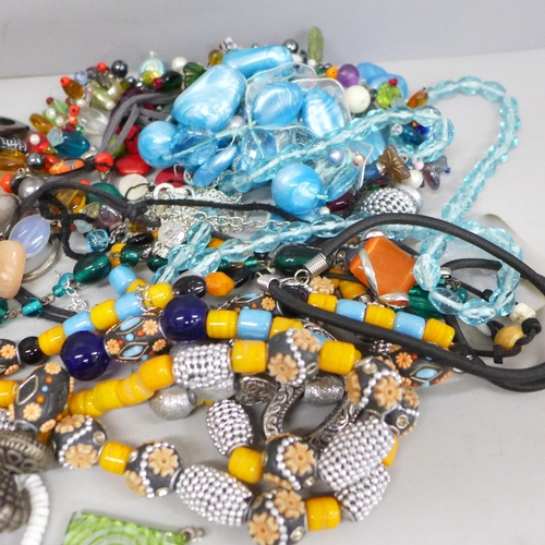 719 - A collection of glass bead and stone jewellery including shells and pearls