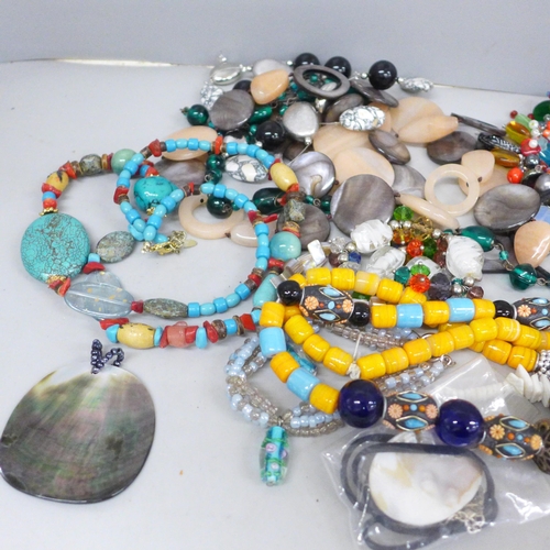 719 - A collection of glass bead and stone jewellery including shells and pearls