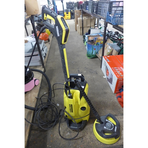 5303 - A Karcher K4 full control jet wash with hose, lance and patio cleaner  attachment