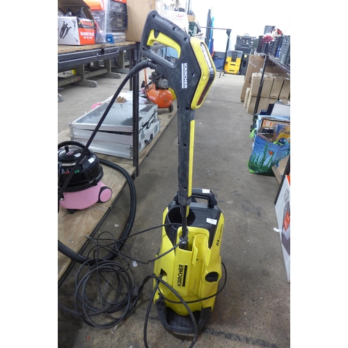 5303 - A Karcher K4 full control jet wash with hose, lance and patio cleaner  attachment