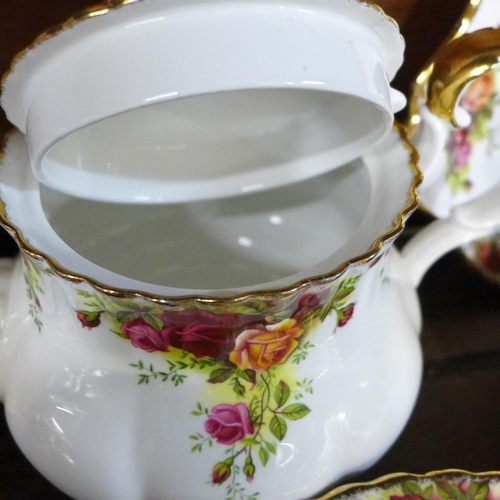 724 - A six setting Royal Albert Old Country Roses china tea service with bread and butter plate, two pots... 