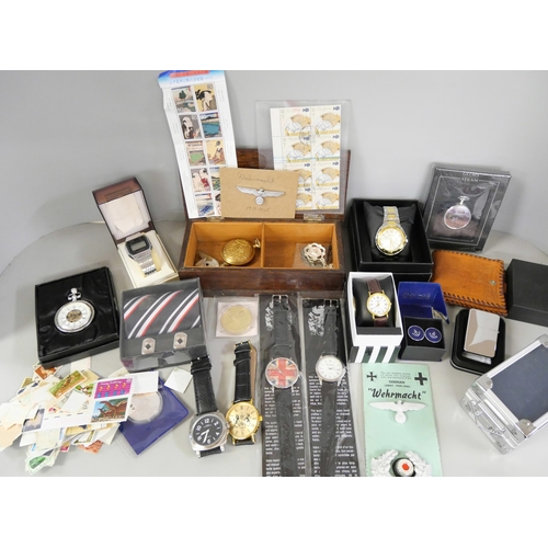 729 - A collection of watches, coins and badges