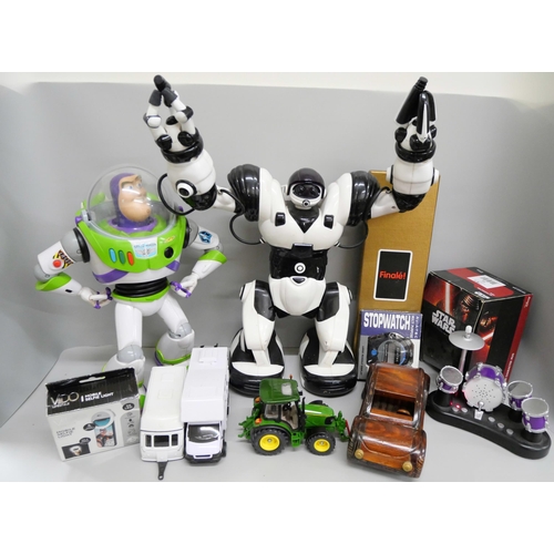 733 - A collection of childrens toys including Buzz Lightyear figure, a robot, a Star Wars mug, a Siku far... 