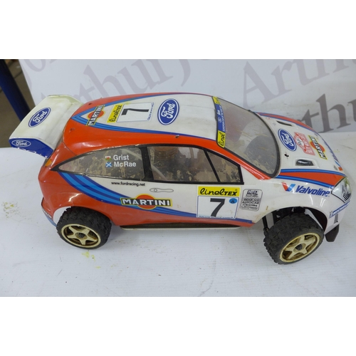 5327 - A box of RC cars and component parts and other related items including a petrol powered Kyosho RC ca... 