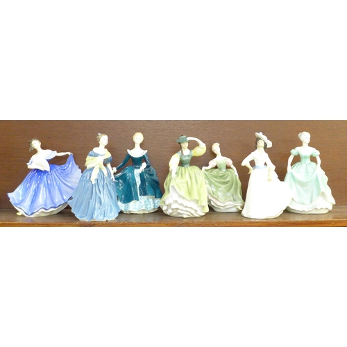 602 - A collection of six Royal Doulton figures and a Coalport figure