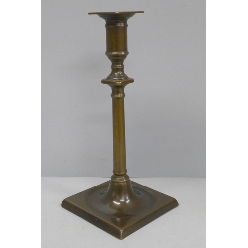 604 - A Scottish bronze candlestick, 25cm