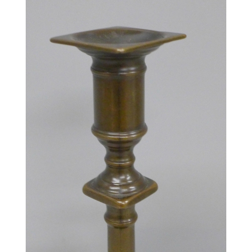 604 - A Scottish bronze candlestick, 25cm