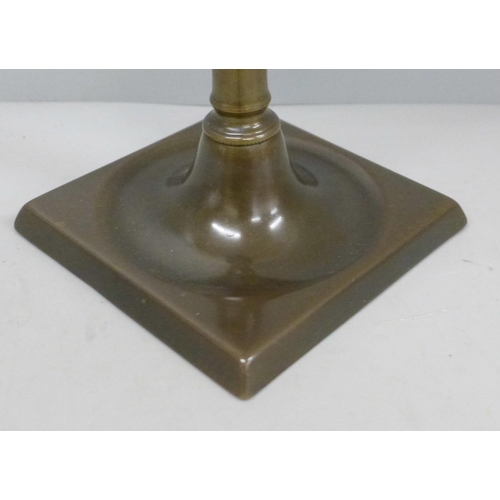 604 - A Scottish bronze candlestick, 25cm