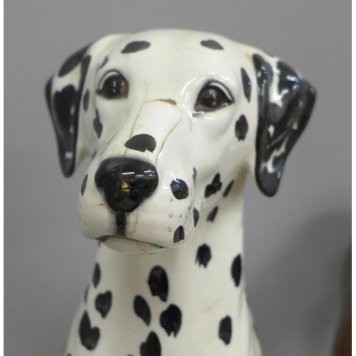 606 - Two Beswick figures, dalmatian, damage to nose and a large racehorse, one ear restored