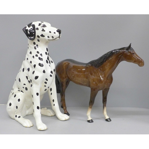 606 - Two Beswick figures, dalmatian, damage to nose and a large racehorse, one ear restored