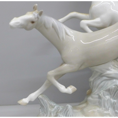 608 - A large Lladro figure group, two Galloping Horses, 37cm