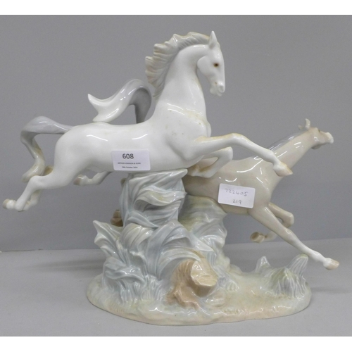 608 - A large Lladro figure group, two Galloping Horses, 37cm