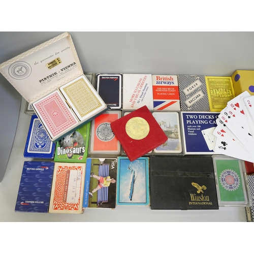 773 - A collection of playing cards, over 25 sets