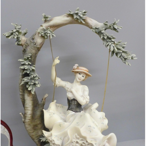 611 - Two Florence Guiseppe Armani figures including Young Lady on Swing, 35cm and 38cm