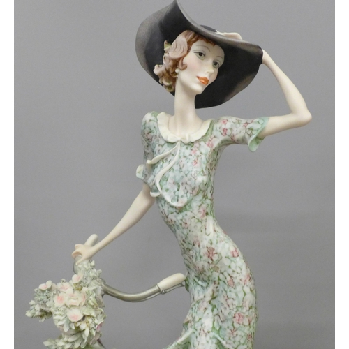 611 - Two Florence Guiseppe Armani figures including Young Lady on Swing, 35cm and 38cm