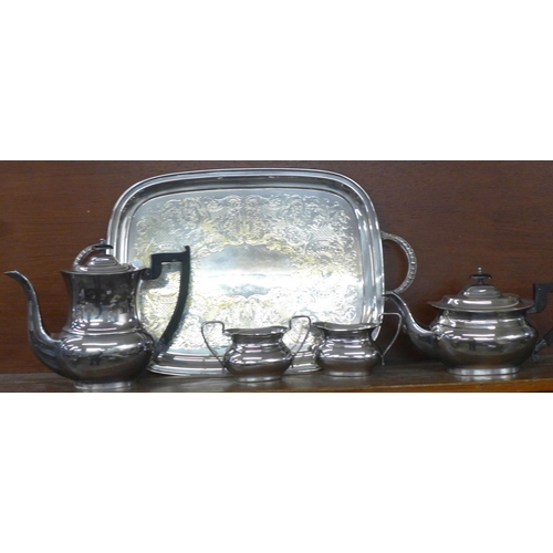 617 - A four piece EP on brass tea service, Viners of Sheffield and a plated two handled serving tray