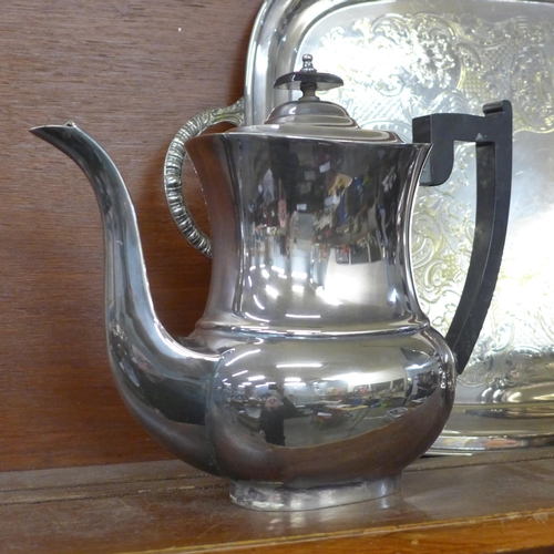 617 - A four piece EP on brass tea service, Viners of Sheffield and a plated two handled serving tray