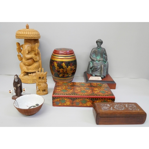 790 - A bronzed seated Arab figure, decorative wooden boxes, wooden figure of Ganesh and a small china bow... 