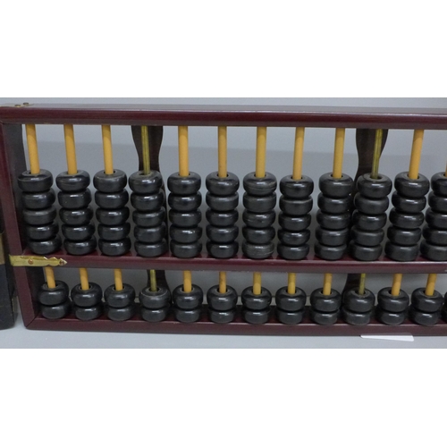 619 - Two vintage Taiwanese abacus