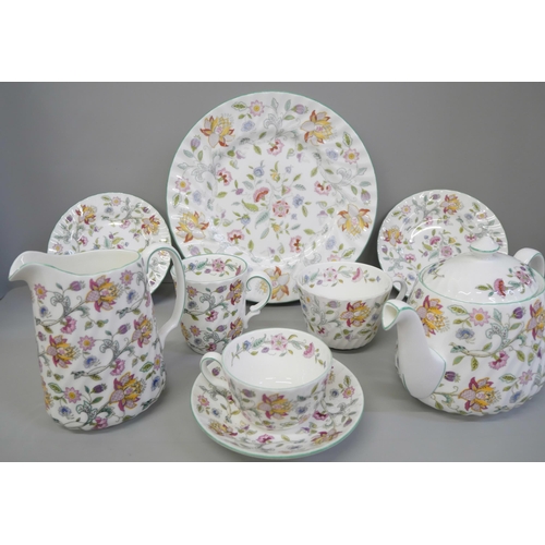 795 - A Minton Haddon Hall dinner and tea service including twelve dinner, tea and side plates, some piece... 