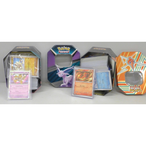 634 - 600+ Pokémon cards including 40+ Holographic with reverse Holos and Black Star Rare in two tins