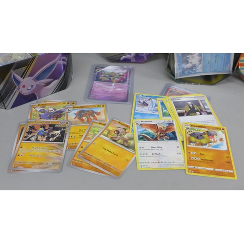 634 - 600+ Pokémon cards including 40+ Holographic with reverse Holos and Black Star Rare in two tins