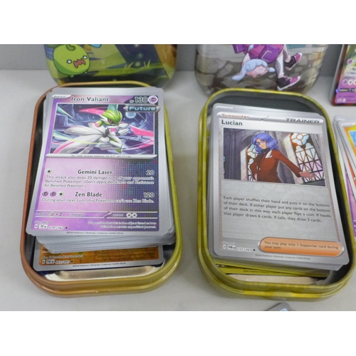 636 - 150+ Holographic Pokémon cards in collector tins