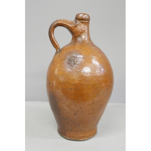 813 - An earthenware salt glaze flagon, neck broken and restored