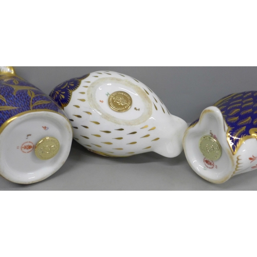 638 - Three Royal Crown Derby paperweights, owl, koala and penguin, tow gold and one silver stopper