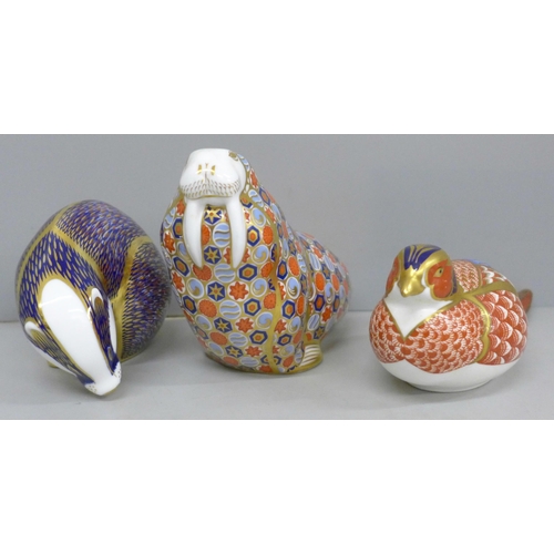 639 - Three Royal Crown Derby paperweights, partridge, badger and walrus, two with gold stoppers