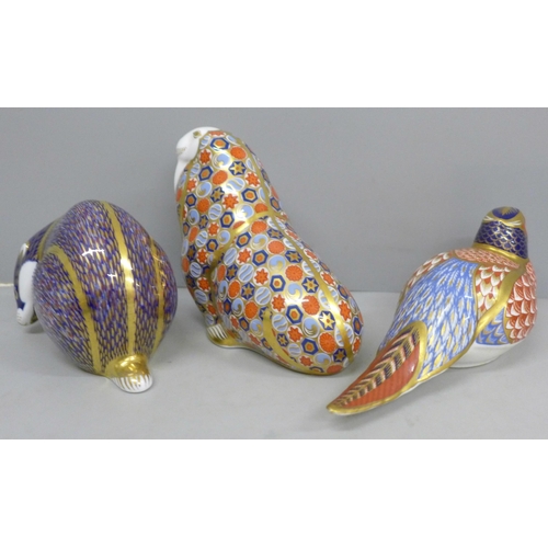 639 - Three Royal Crown Derby paperweights, partridge, badger and walrus, two with gold stoppers