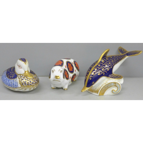 641 - Three Royal Crown Derby paperweights, dolphin, sow and duck, two with gold stoppers