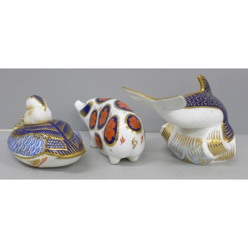 641 - Three Royal Crown Derby paperweights, dolphin, sow and duck, two with gold stoppers