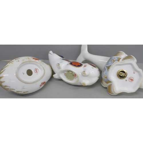 641 - Three Royal Crown Derby paperweights, dolphin, sow and duck, two with gold stoppers