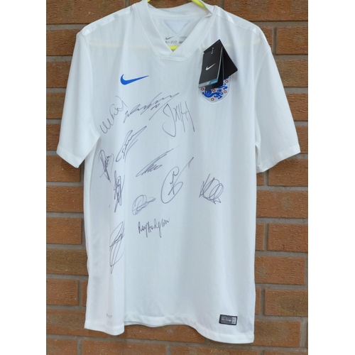 826 - An England football shirt, 2014, signed by the team