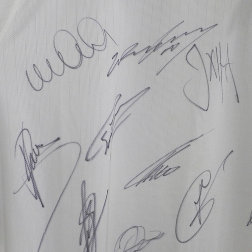 826 - An England football shirt, 2014, signed by the team