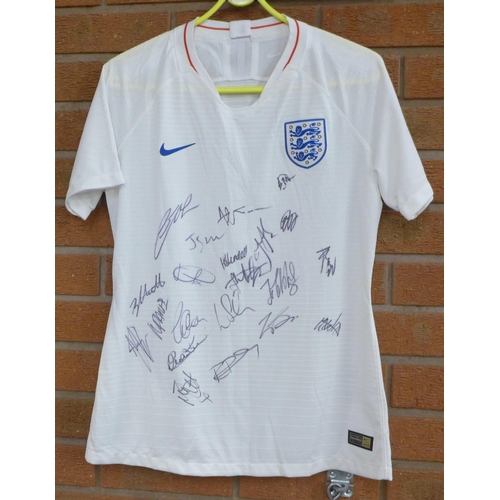 831 - A lady's England football shirt, signed by the team, 2018