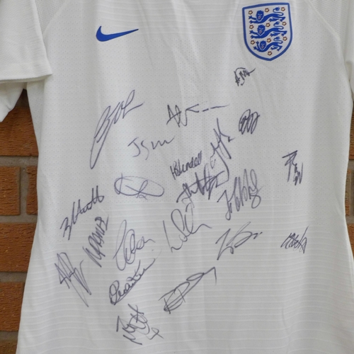 831 - A lady's England football shirt, signed by the team, 2018