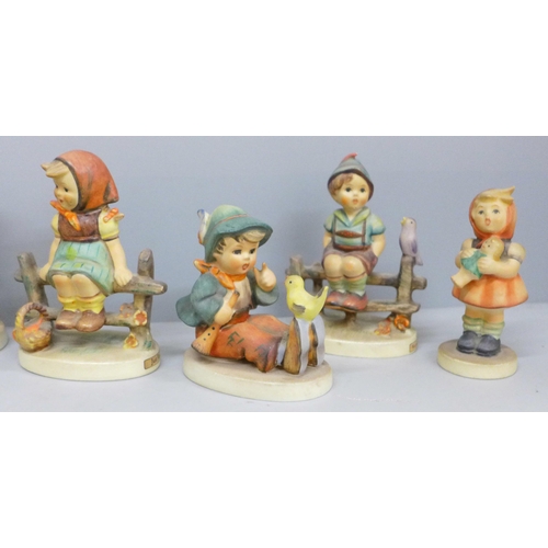 655 - Seven Goebel figures and a miniature cup and saucer