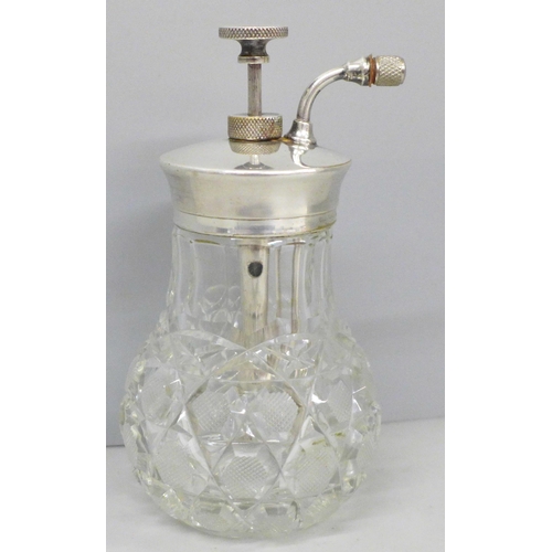 657 - A cut glass perfume atomiser with plated top