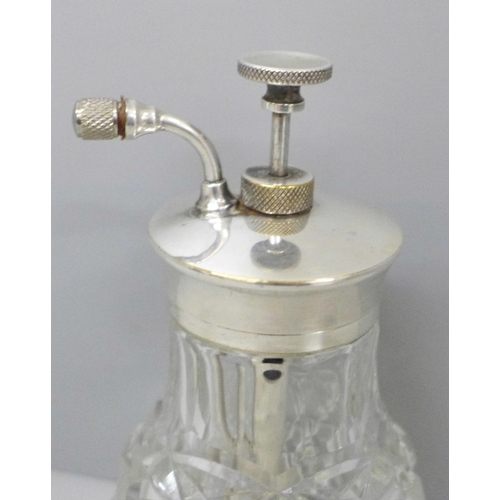 657 - A cut glass perfume atomiser with plated top