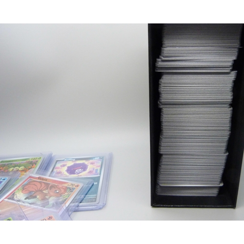 848 - A collection of 550+ 151 Scarlet and Voilet Pokémon cards including Holographic in top loaders prote... 