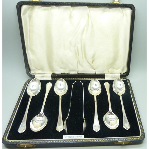 855 - A cased set of six silver spoons with sugar bows, 84g