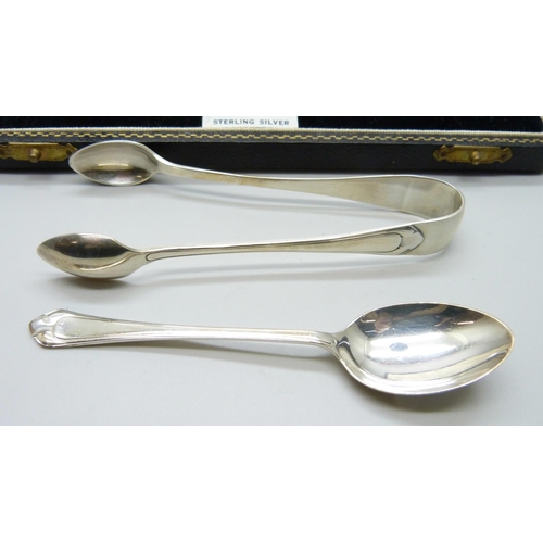 855 - A cased set of six silver spoons with sugar bows, 84g