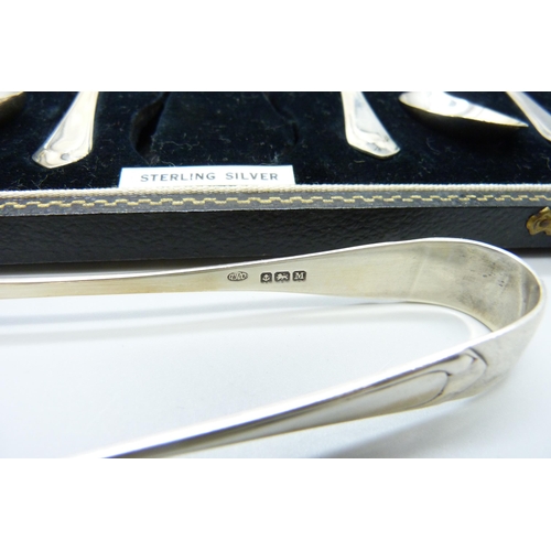 855 - A cased set of six silver spoons with sugar bows, 84g