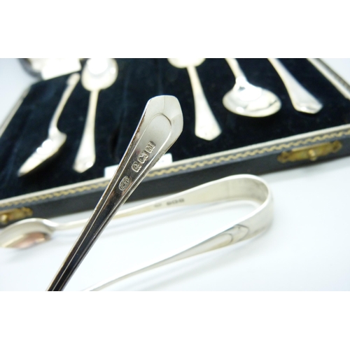 855 - A cased set of six silver spoons with sugar bows, 84g