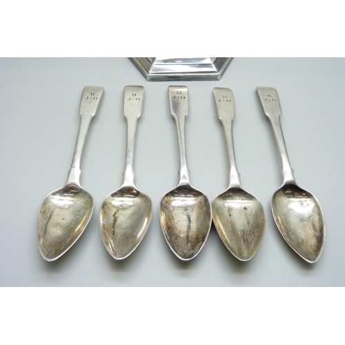 858 - Five Georgian silver teaspoons, 83g, and a silver candlestick