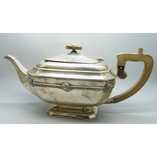 860 - A silver teapot and a silver spoon, 835g